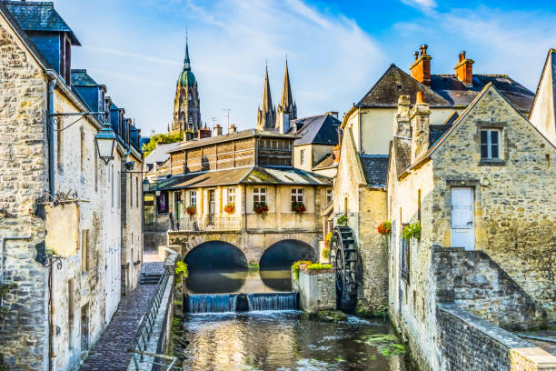 Colorful Old Buildings Mill Cathedral Aure River Reflection Bayeux Center Normandy France. Bayeux transfer cdg airport Bayeux